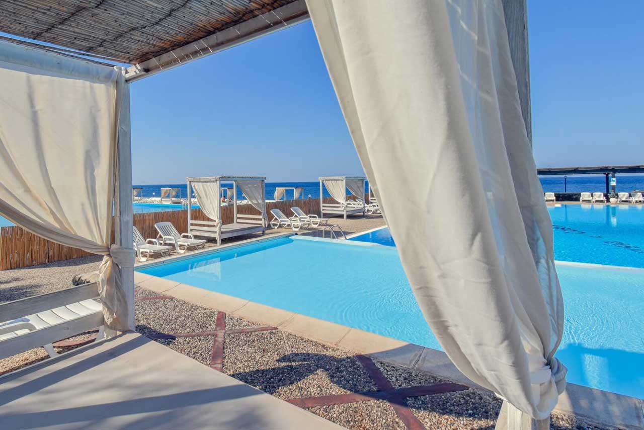 Room overlooking the pool at Mursia Hotel